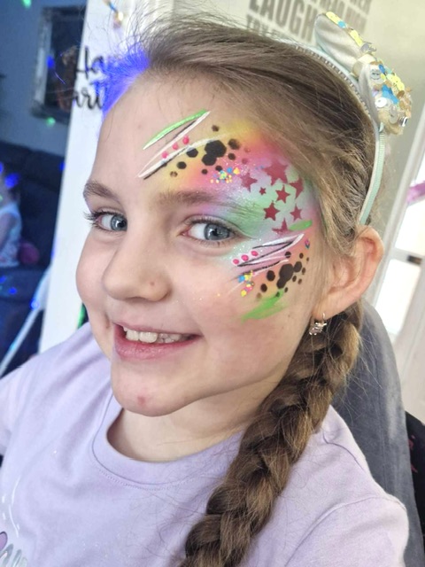 Girl with a grafitti style face paint in Telford